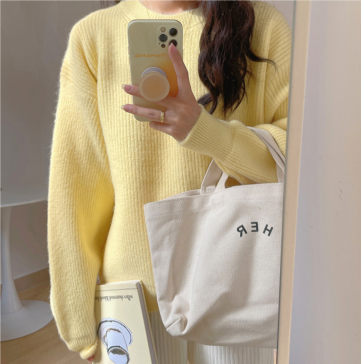 Knitted long sleeved sweater for women